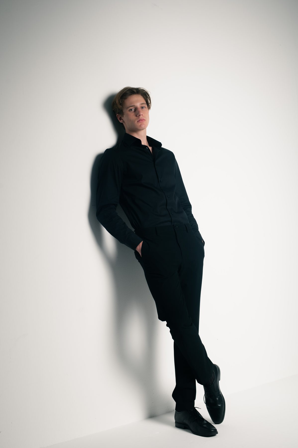 Bastian Gandy, standing portrait, black shirt