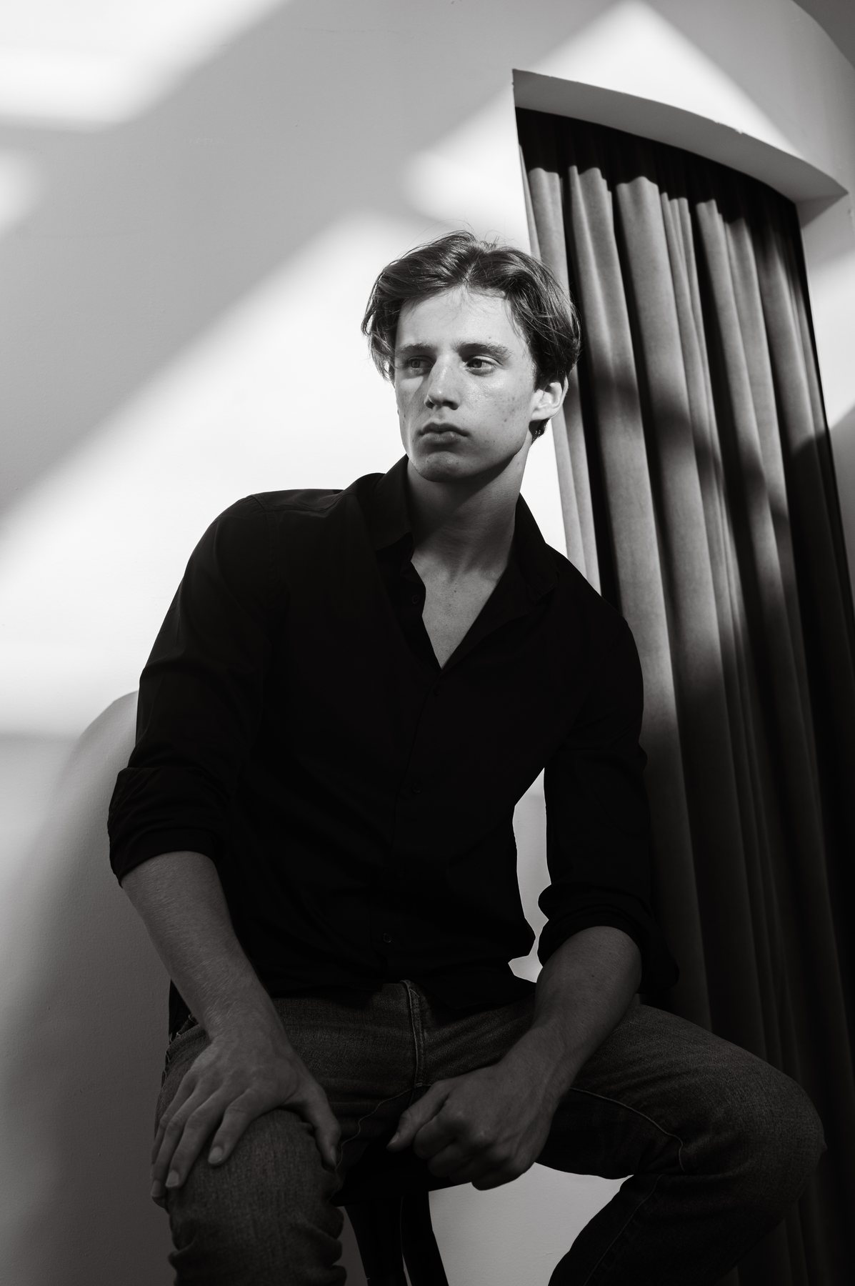 Bastian Gandy, seated portrait, black and white